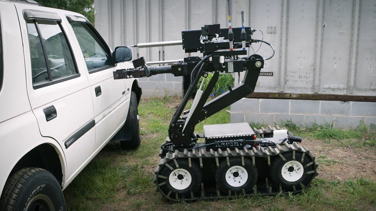 An Amphibious Armoured Vehicle, a Bomb Robot, and a Life Raft